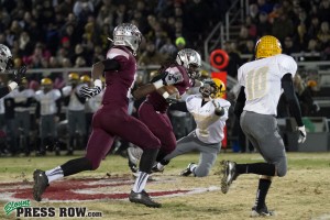 Tyson stiff arms a Bees defensive back en route to an Alcoa touchdown.