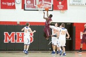 Alcoa's Nick Miller glides to the basket for two.