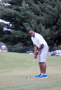 Ex-Marine and former William Blount Governor Marcus Kenny lines up a chip during the Wounded Warrior Golf Tournament on Monday at Green Meadow Country Club. Photos by Jolanda Jansma