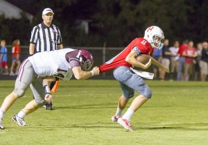  Mountaineer backup Cameron Carter attempts to free himself from Bearden's 