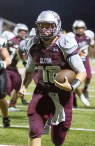 Mitchell McClurg carries for the Tornadoes at quarterback.
