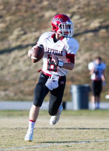 Maryville Junior High quarterback Cole Grubbs rolls to throw.