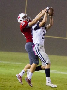 Mountaineer defensive back Hunter Terry fights for the ball with Farragut's Justin Kirkendall.