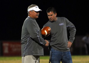 Alcoa coach Gary Rankin receives the game ball from Alcoa athletics director Josh Stephens after becoming the school's all-time winningest coach last season. With three more wins, Rankin will own the state record as well. Photo by G.W. Meridith
