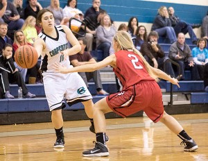 Carpenters' Madi Hartgrove looks to pass the ball around Maryville Junior High's Rachel Reid in the Blount County championship game Tuesday night.