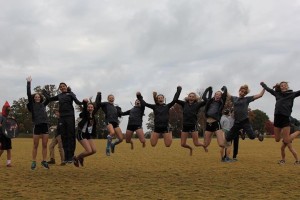 The Lady Rebels jump for joy after qualifying as a team for state.