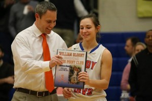 William Blount coach Todd Wright presents Roddy with a plaque before the game commemorating her induction into the 1,000-point club.