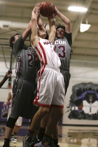 Maryville's Ashton Maples goes up for the rebound with Roberts, left, and Ty Boyd.