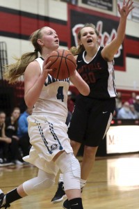 Carpenters Jenna Kallenberg drives the baseline against Maryville's Sarah Satterfield. The two middle school stars will be heard from in a hurry at the next level.