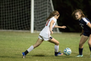 Sophomore Grace Oliver works the ball around a Farragut defender.