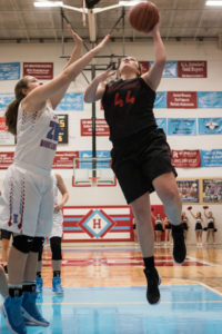 Lindsay Taylor goes to the basket against Heritage's ? on Friday.